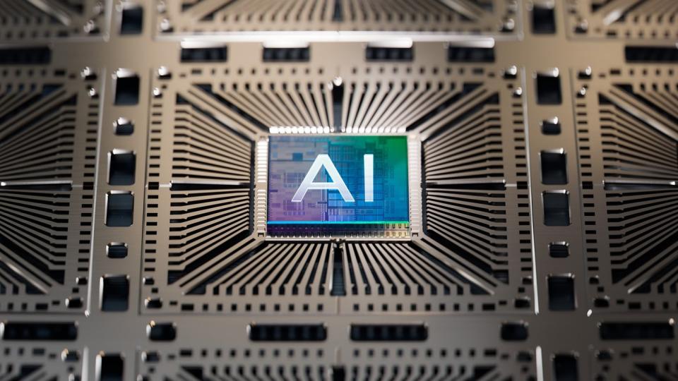 A computer chip embedded in a circuit board with the letters AI embossed on the top. 