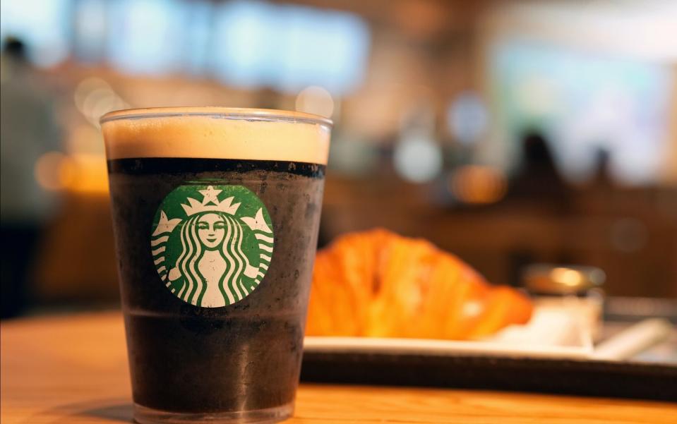 A Starbucks drink rests on a table