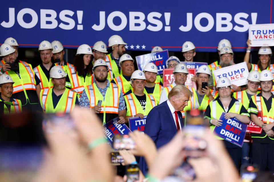 Former US President and Republican presidential candidate Donald Trump arrives to speak about the economy during a campaign event in Potterville, Michigan, on August 29, 2024.