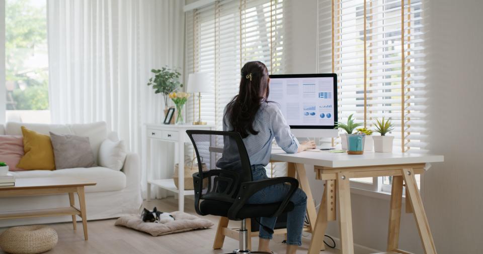 An employee works from home at their remote work setup.