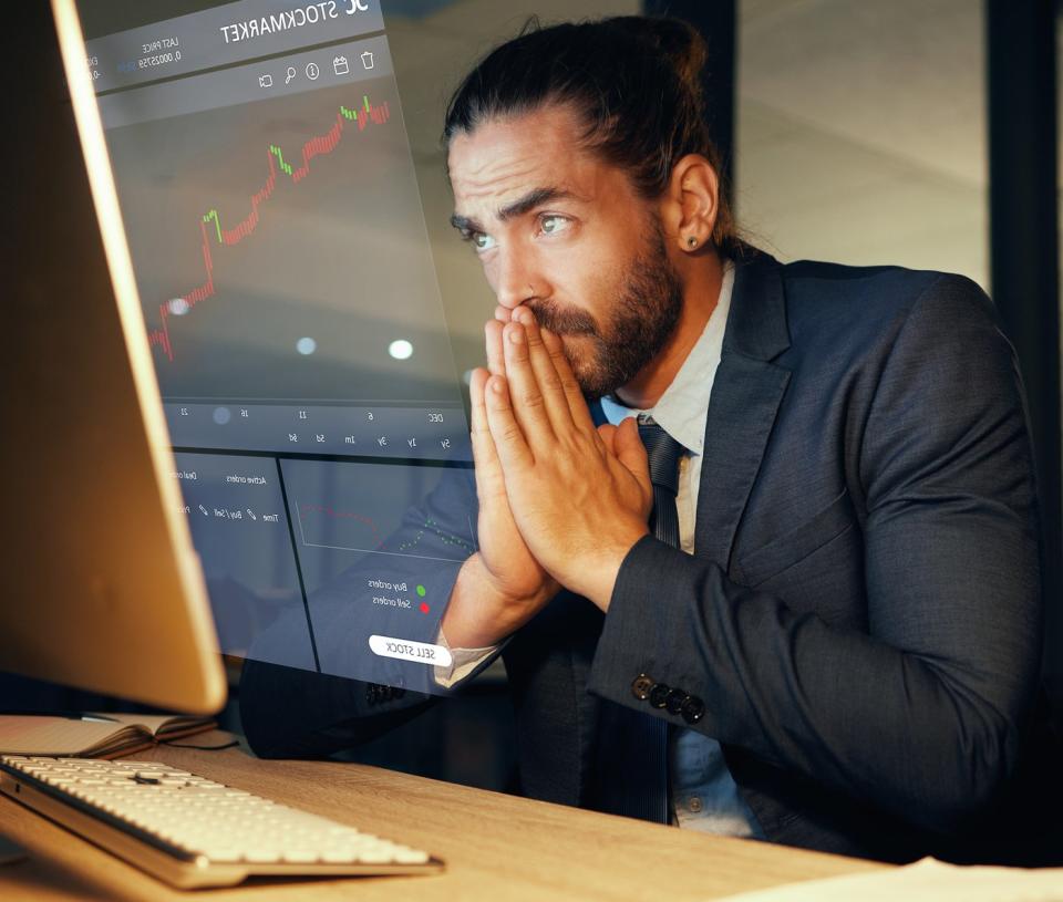 Nervous person looking at a stock chart.