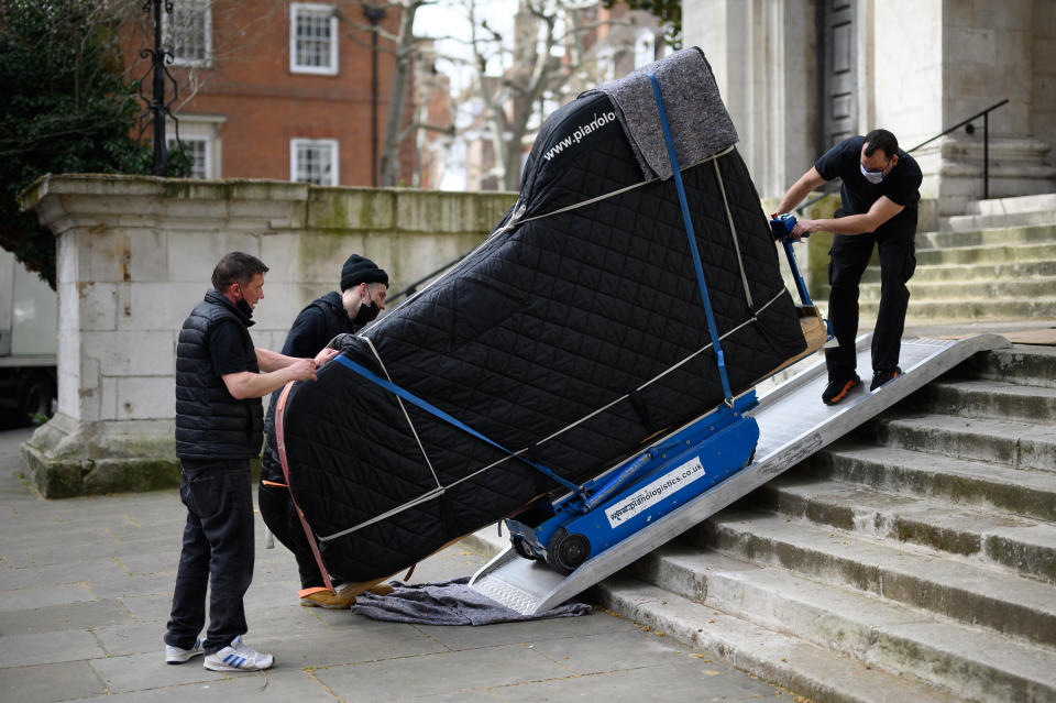 LONDON, UNITED KINGDOM - APRIL 01: A removals company carefully transport a grand piano down a flight of stairs outside St John's Smith Square on April 01, 2021 in London, England. (Photo by Leon Neal/Getty Images)