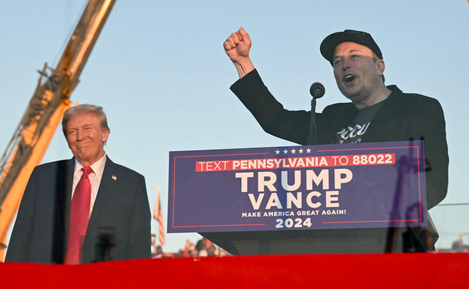 Tesla CEO Elon Musk (R) speaks on stage as he joins former US President and Republican presidential candidate Donald Trump during a campaign rally at site of his first assassination attempt in Butler, Pennsylvania on October 5, 2024. (Photo by Jim WATSON / AFP) (Photo by JIM WATSON/AFP via Getty Images)