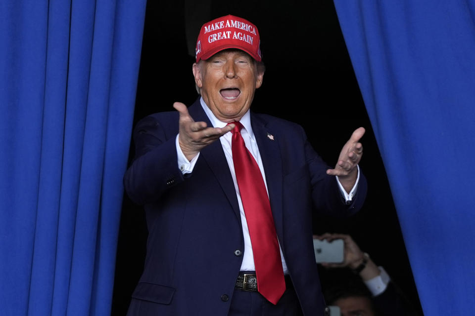 Republican presidential nominee former President Donald Trump arrives to speak during a campaign rally at Dodge County Airport, Sunday, Oct. 6, 2024, in Juneau, Wis. (AP Photo/Julia Demaree Nikhinson)