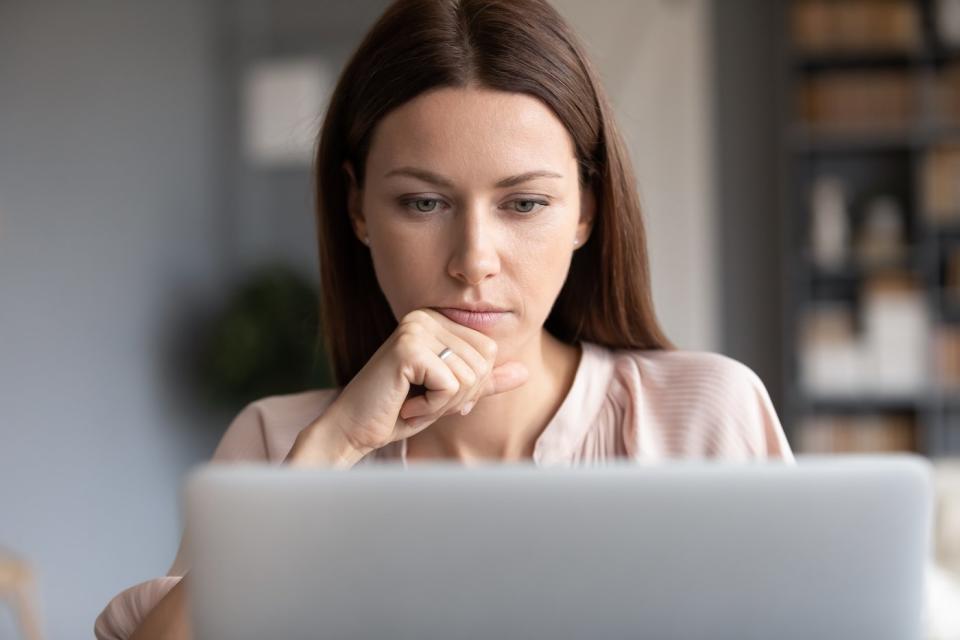 Person looking intently at computer.