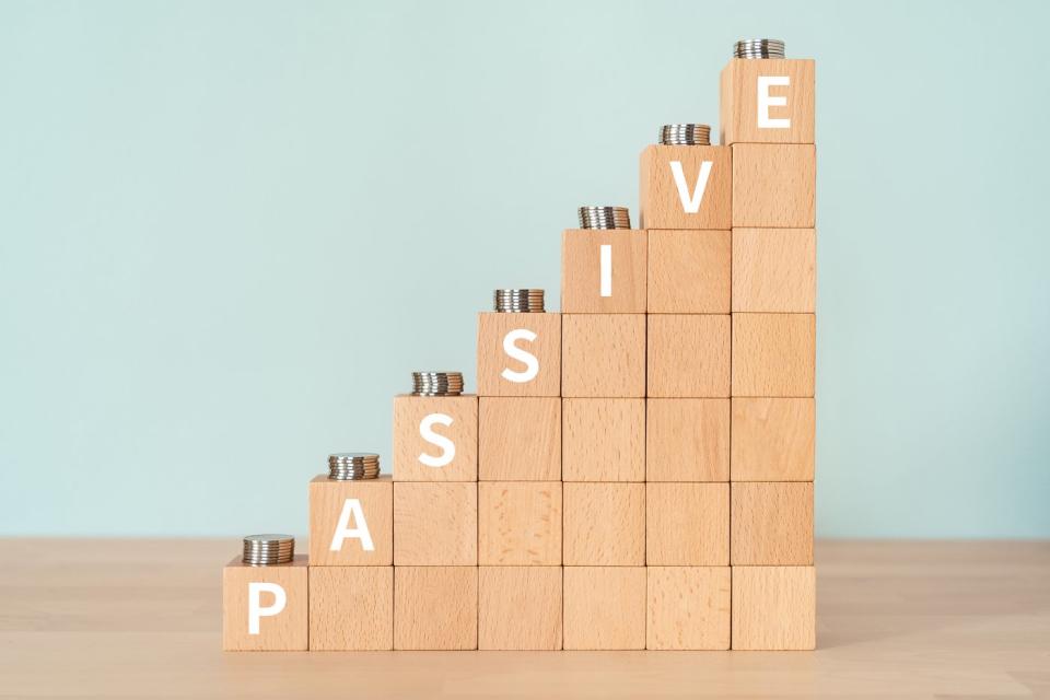 Wooden blocks arranged in a growth pattern with the word passive written on the side.