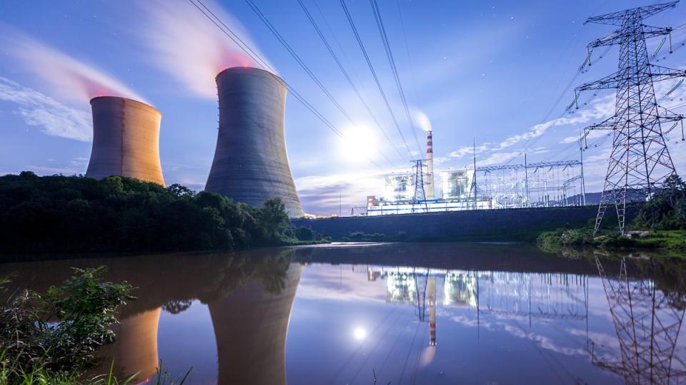 A nuclear power plant with power lines running overhead.