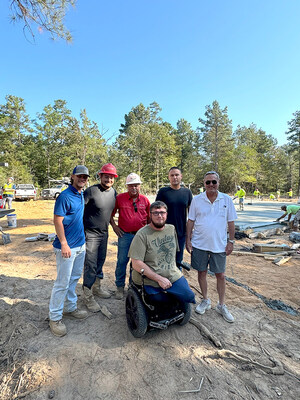 Veteran, Zach Parker and construction team at the home site.