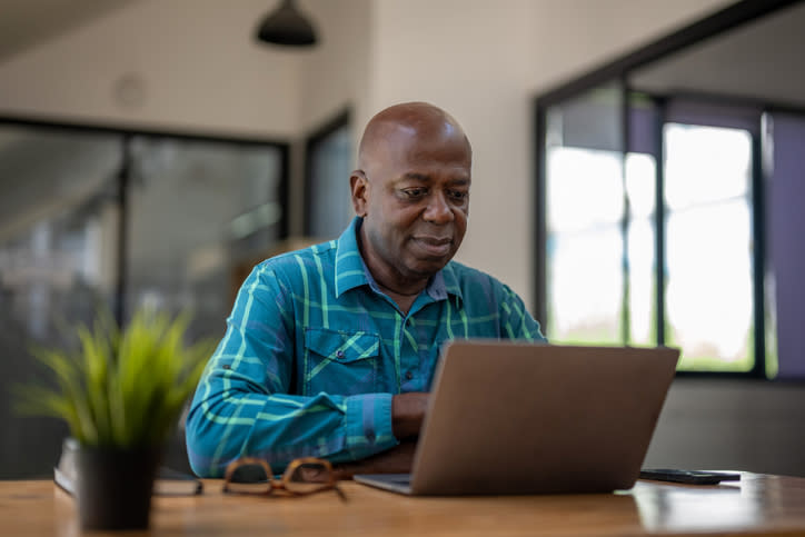 A man calculates how much his Social Security benefits will be if he waits until age 69 to claim them.