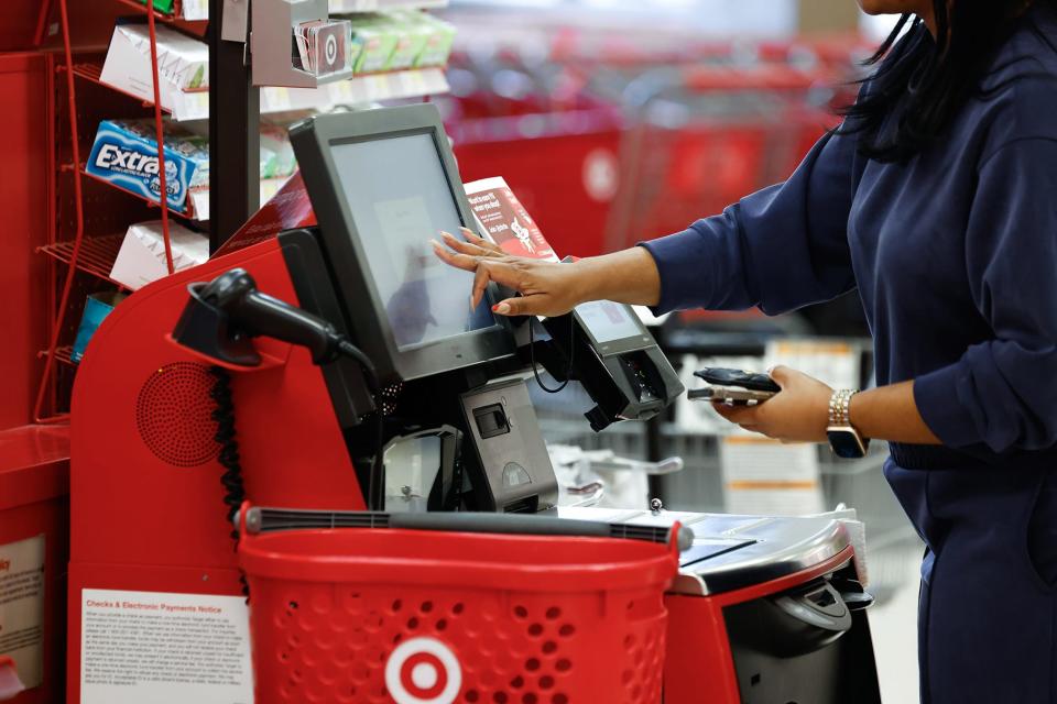 A shopper checks out at Target.