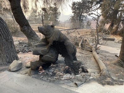 A burned bear statue at Summerkids Camp in Altadena, CA, after the Eaton Fire.